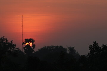 Orange light of Sunrise and silhouette in the morning