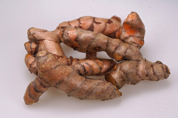 Closeup curcuma herb roots, a important natural Oriental antioxidant for our wellbeing , which helps against fever and influenza