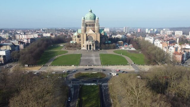 Basilica of Koekelberg with traffic around roundabout over Elisabeth Park. Drone aerial view