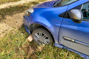 Car ending up in a drainage ditch after joy riders tried to take a short cut across a field at...