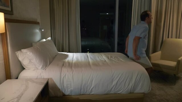 Man jumping on the bed in slow motion 180fps
