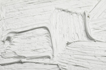 Texture of white oil paint as background, closeup