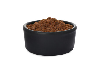 Bowl with nutmeg powder on white background