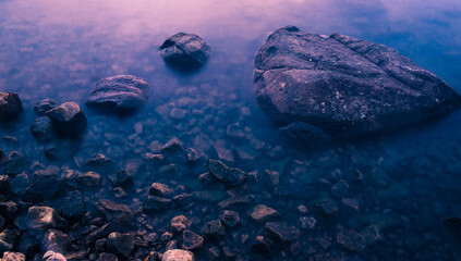Fototapeta na wymiar Rocks on a serene blue sea