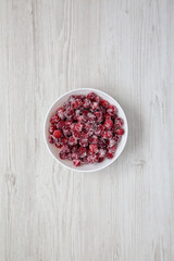 Red Sugared Cranberries in a Bowl, top view. Flat lay, overhead, from above.