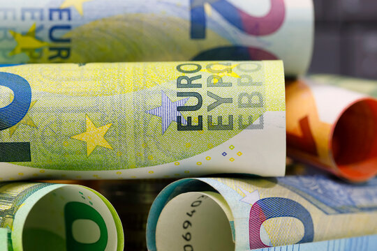 Rolls of Euro banknotes stacked, EUR currency