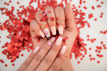 Nail design with double French, doll holding a heart and heart of golden glitter with special...