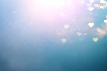 blue and pink glitter vintage lights background. defocused. hearts overlay