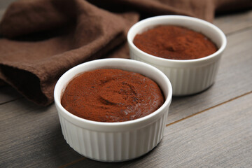 Delicious fresh chocolate fondant on wooden table