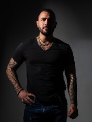 Portrait of handsome man on black studio.