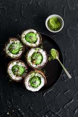 Matcha coconut ice cream on grey background