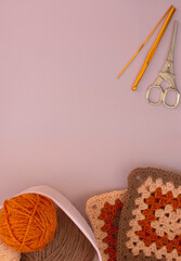 background with balls of yarn and tools for knitting