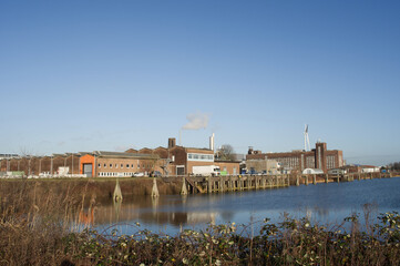 Cityscape of a industrial area with factories and industrial chimneys in Arnhem in the Netherlands