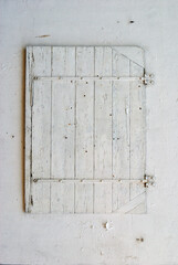 Close Up of Old White Painted Wooden Window Shutter 