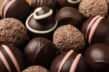 Many different delicious chocolate truffles, closeup view