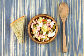 Olivier salad and a slice of bread.
