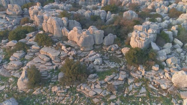 Drone flight over the karst landscape of El Torcal with limestone rocks and pillars, Andalusia, Spain