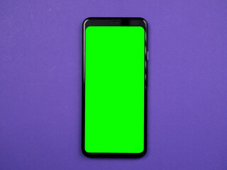 smartphone with green chromakey screen on color background