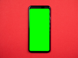 smartphone with green chromakey screen on color background