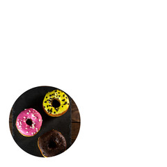 strawberry, lemon and chocolate donuts on wrapping paper. copy space. white background.