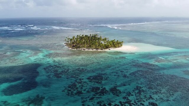 Aerial shot around a Caribbean island protected by the coral reef of the Atlantic Ocean. archipelago of guna yala, panama, San Blas. (no color Correction