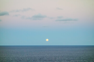 super full moon rises up to sky, over the sea