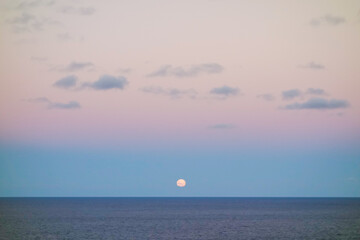 super full moon rises up to sky, over the sea