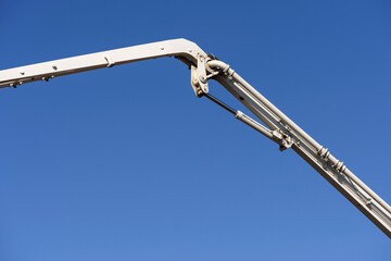 Truck mounted сoncrete pump and concrete mixer at a construction site. Concrete pouring...