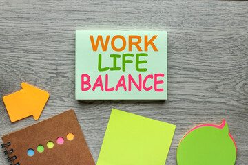 work life balance blank notepad with pen and notebook on wooden background