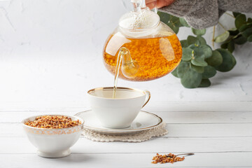 Buckwheat (soba) tea Japanese drink in a transparent teapot
