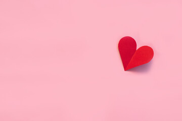 Valentines day paper heart on pink background. View from above. Valentines Day Concept.