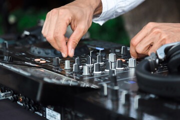 Disc jockey playing music for people at party outdoors - Dj at music live event - Live event, music...