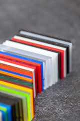 Multi-colored samples of organic glass. Colorful acrylic sheets plastic swatches, craft and...