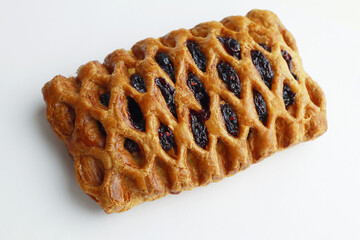 Tasty pastry with jam on color background