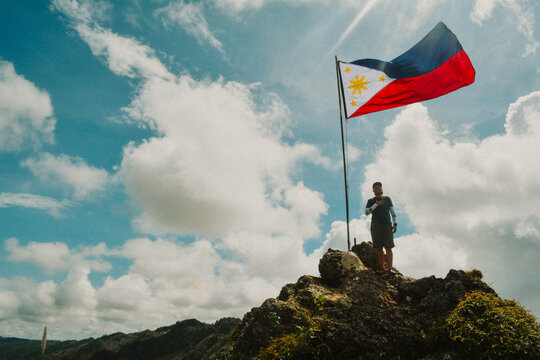 A Proud Filipino Standing On The Summit