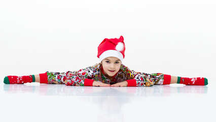 Happy flexible little girl gymnast do cross splits