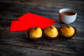 Traditional Chinese New Year Pastry With Tea and Lucky Money Red Packets