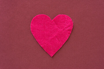 felt heart on a fabric background