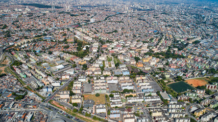 Aerial view of Itaquera, Sao Paulo. Residential buildings, avenues and train
