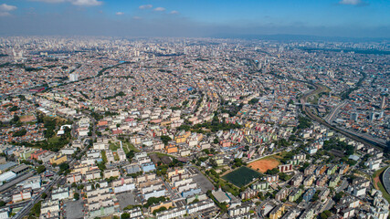 Fototapeta premium Aerial view of Itaquera, Sao Paulo. Residential buildings, avenues and train