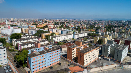Aerial view of Itaquera, Sao Paulo. Residential buildings, avenues and train