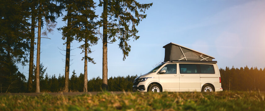 Modern Camping Van parking at the forest in beautiful, authentic nature