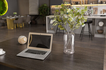 brutal interior of an ultra-modern spacious one-room apartment in dark colors super cool led lighting with kitchen, dining table and home office area