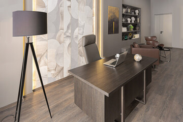 stylish luxury home office interior in an ultramodern brutal apartment in dark colors and cool led...