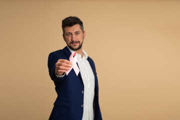 Man With Pink Ribbon Supporting Breast Cancer Cause