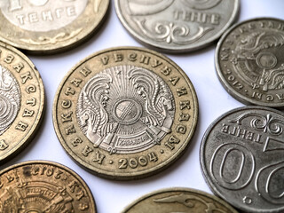 Close-up of coins of the Republic of Kazakhstan on a white background. Currency photography