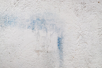old white wall with blue stains abstract background
