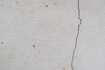 white cement wall with a crack texture