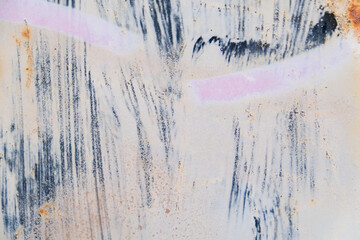 Paint stains on a weathered metal surface abstract background