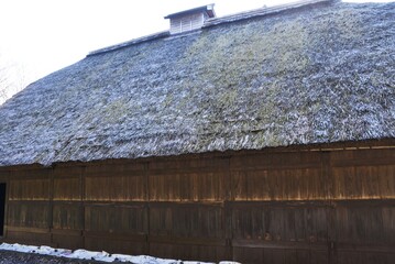 A thatched-roof dwelling of a wealthy farmer built in 1804 during the Edo period in Japan.  - obrazy, fototapety, plakaty